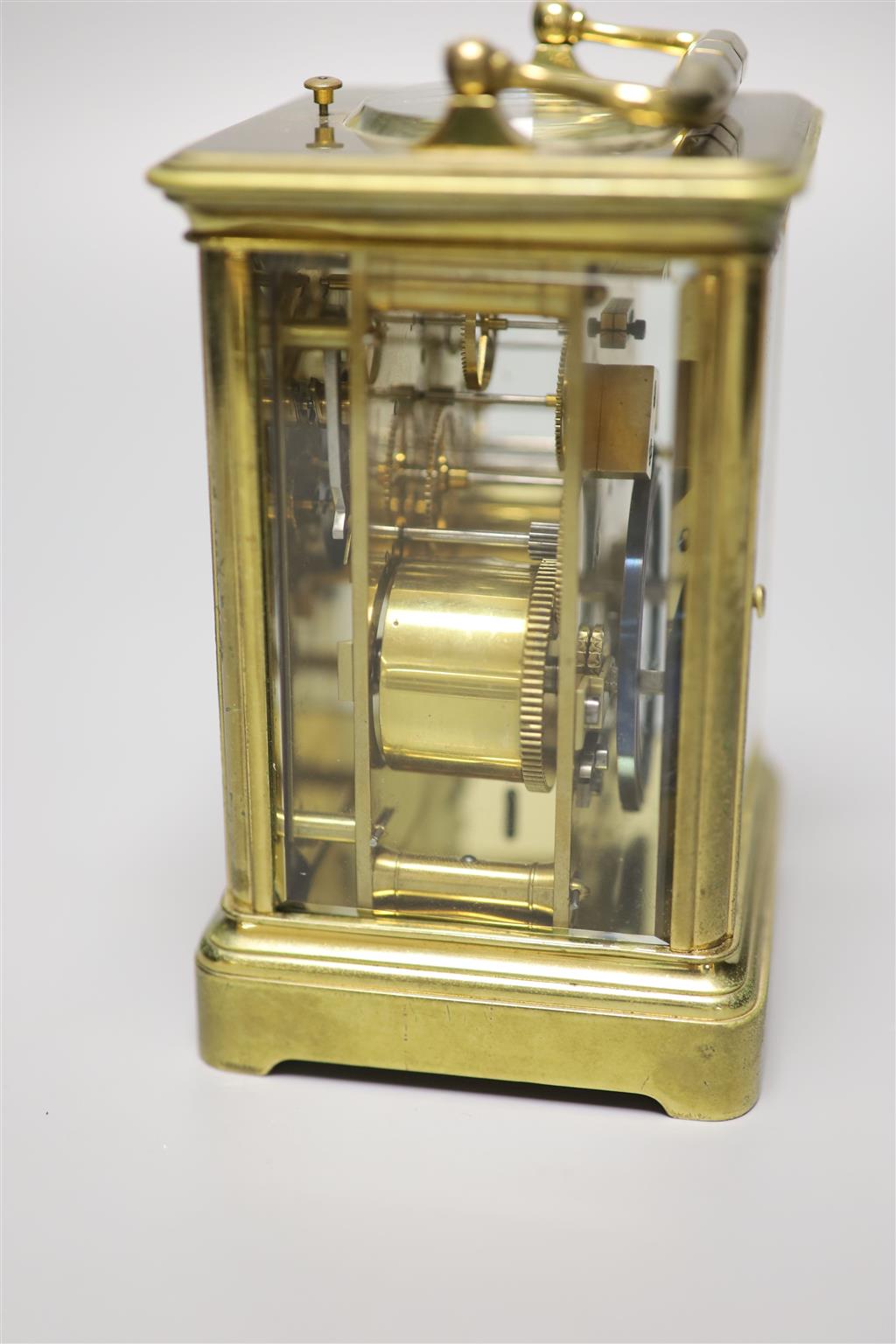 A brass carriage clock by Howell James & Co, height with handle down 13.5cm